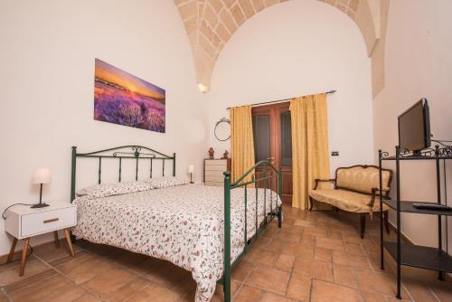 Cama o camas de una habitación en Appartamenti "Il Delfino"