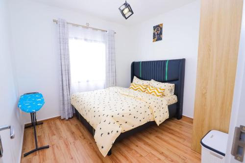 Postel nebo postele na pokoji v ubytování Tatu Haven in Tatu City