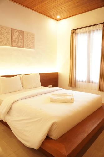 Postel nebo postele na pokoji v ubytování Lantis ViBES Inn