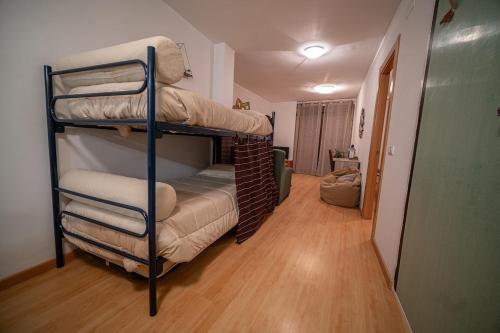 a room with two bunk beds in a room at Las Torres 2 in Calatayud
