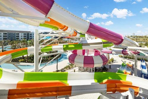 a colorful roller coaster at a theme park at Villatel Orlando Resort in Orlando