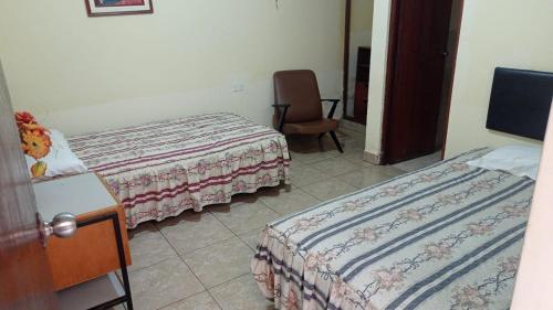 Ένα ή περισσότερα κρεβάτια σε δωμάτιο στο Hotel Perseo Inn
