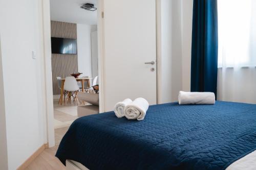 Posteľ alebo postele v izbe v ubytovaní Locus Apartments