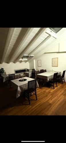 a room with tables and chairs in a building at Affittacamere Cà della Roggia in Rovereto
