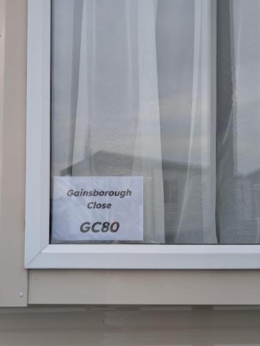a sign in a window that reads centurion close at LuKa25 GC080 in Saint Osyth