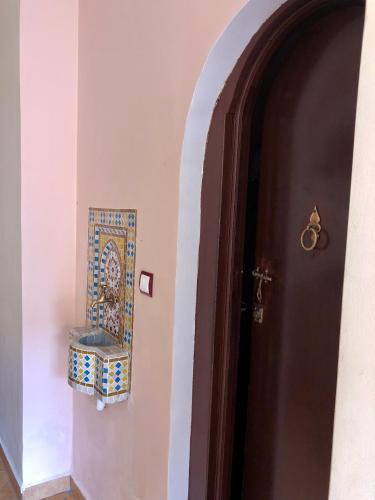 a door to a room with a mosaic tile on the wall at Luxury Villa Riad Style - WIFI & PARKING in Agadir
