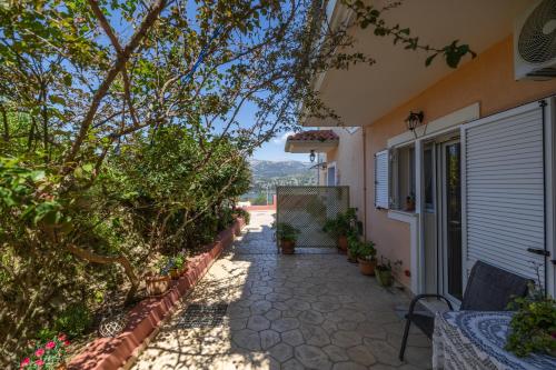 a house with a pathway leading to a house at Estia cozy apartment in Argostoli