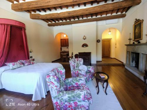Ένα ή περισσότερα κρεβάτια σε δωμάτιο στο Residenza d'Epoca Il Cassero
