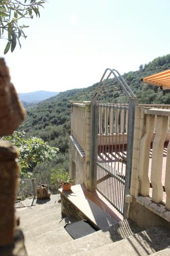a balcony with a view of a mountain at A BeautifuL Terrace on Paradise Imperia - by HOST4U in Montegrazie