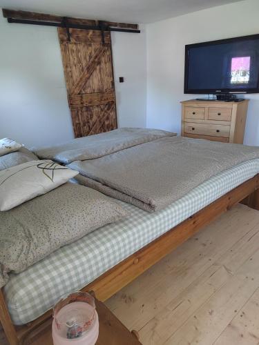 Ein Bett oder Betten in einem Zimmer der Unterkunft Apartmán Kristian