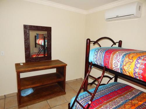 Ένα ή περισσότερα κρεβάτια σε δωμάτιο στο Casa Catrina