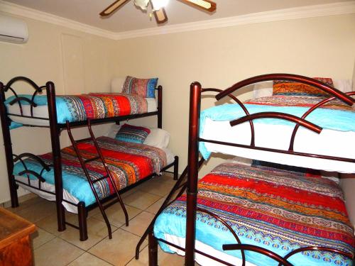 Una cama o camas en una habitación de Casa Catrina