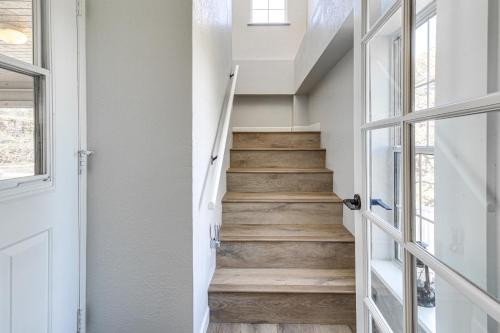 a staircase in a house with wooden floors at Walk to Dtwn Show Low Townhome with Balcony in Show Low