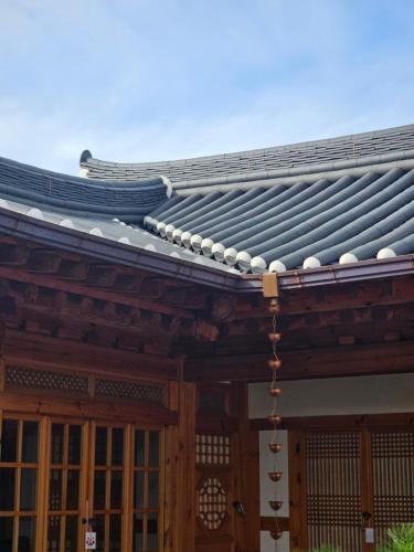 an old wooden building with a gray roof at SiEunJae in Gyeongju