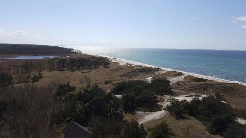 an aerial view of a beach with the ocean at Captain Pahlen Ferienanlage in Zingst