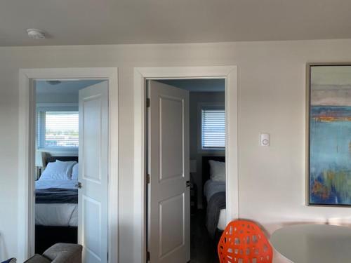 a room with a bedroom with a bed and a tub at Ocean Shores Resort in Ocean Shores