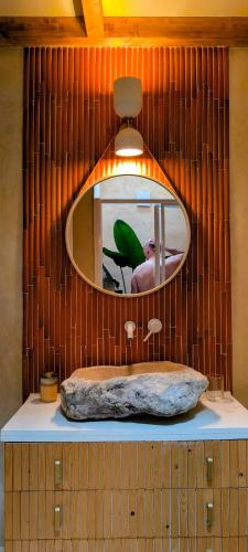 a bathroom with a mirror and a sink at AMEIO - Country House in Rio Maior