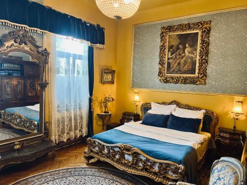 a bedroom with a bed and a mirror at Classic Love Story in Old Cluj I in Cluj-Napoca