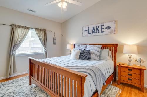 a bedroom with a large bed and a window at 4 Mi to Dtwn Gem with Lake Access in Camdenton in Camdenton
