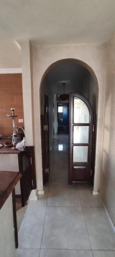 a hallway with a door in a house at bong chalet in Amman