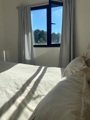 Postel nebo postele na pokoji v ubytování Casita del Mar Chapadmalal