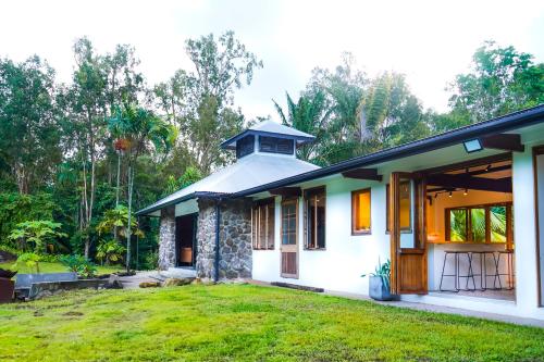a house with a green yard in front of it at The Lake House in Mission Beach