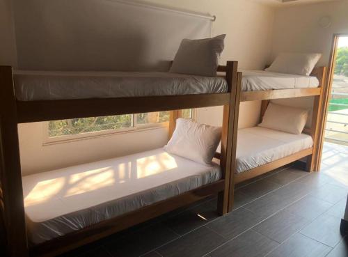 Ένα ή περισσότερα κρεβάτια σε δωμάτιο στο Hotel Punta Piedra