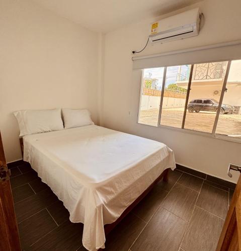 Ένα ή περισσότερα κρεβάτια σε δωμάτιο στο Hotel Punta Piedra