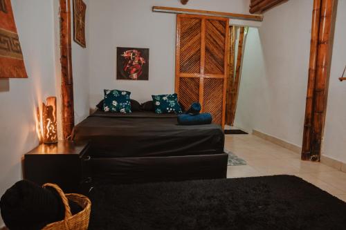 a living room with a bed and a couch at Kasakolà in Palomino