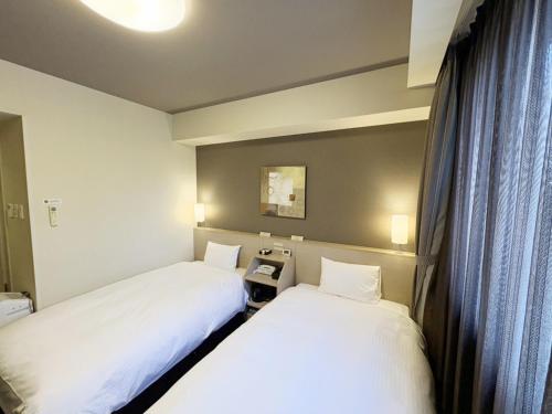 Cama o camas de una habitación en Hotel Route Inn Annaka