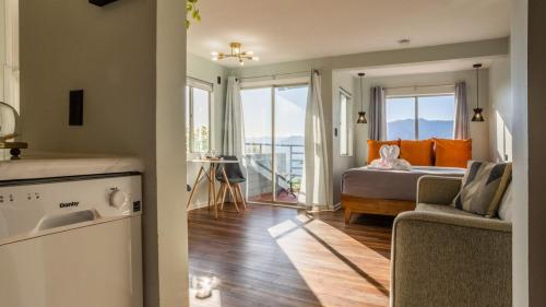 a bedroom with a bed and a view of a balcony at Romantic Exclusive Condo Stunning Mountain View in Gatlinburg