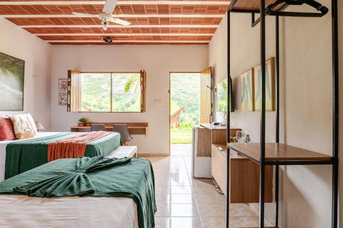 a hotel room with two beds and a sink at Flat Natureza Hotel Fazenda Pedra do Rodeadouro Bonito PE in Bonito