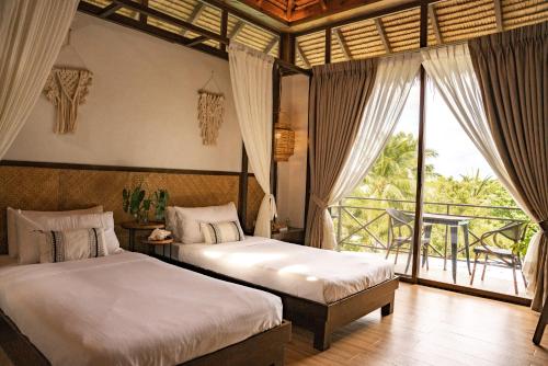 Postel nebo postele na pokoji v ubytování Casas Con Vistas Beach Resort