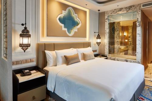 Postel nebo postele na pokoji v ubytování Valia Hotel Bangkok