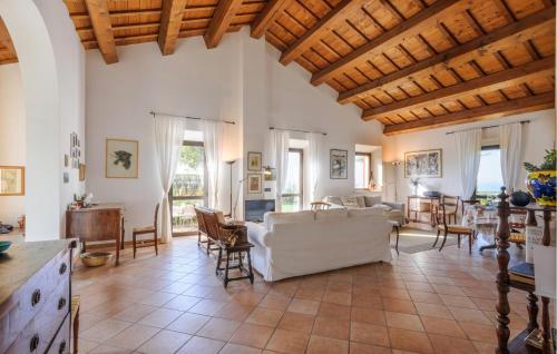 a living room with a white couch and chairs at Amazing Home In Montemarciano With Wifi in Alta Marina