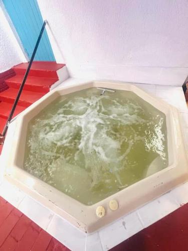 a bath tub filled with water on a table at Executive Accommodation Bellville 2 in Cape Town