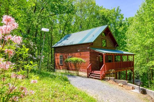 a small cabin in the middle of a forest at Deer To My Heart, Free Attraction Tickets, Hot Tub, Arcade, Air Hockey, WIFI!!! in Sevierville