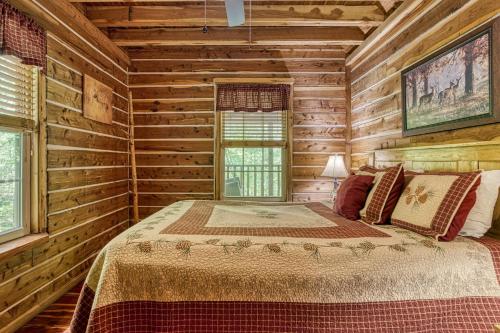 a bedroom with a bed in a log cabin at Deer To My Heart, Free Attraction Tickets, Hot Tub, Arcade, Air Hockey, WIFI!!! in Sevierville