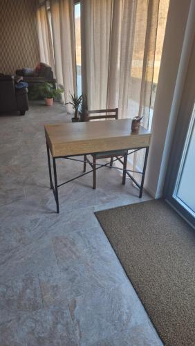 a coffee table in a living room with a couch at Cabana Bendis in Suciu de Sus