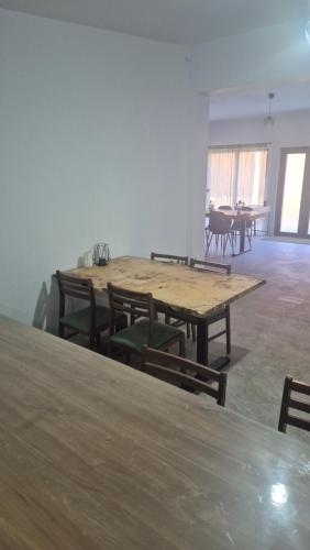 a large room with wooden tables and chairs at Cabana Bendis in Suciu de Sus