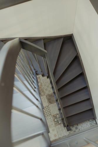 a spiral staircase in a building at Berti in Upesgrīva