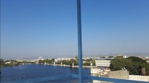 a view of a river from a window at Gladden Villa in Udaipur