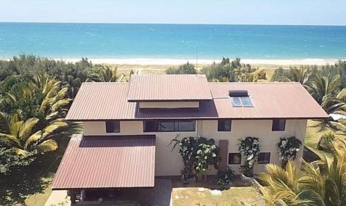 an aerial view of a house with coral roof at The Beach House Kalpitiya in Puttalam