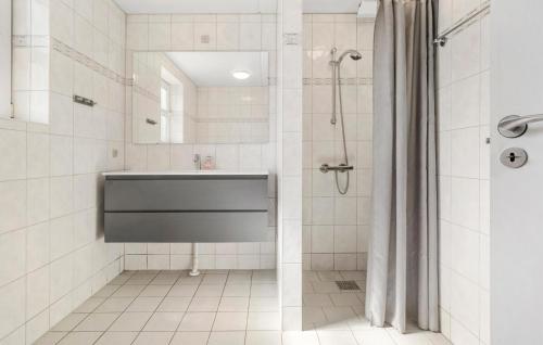 a bathroom with a shower and a sink at Stunning Home In Væggerløse With Wifi in Marielyst