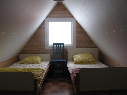 Säng eller sängar i ett rum på Valleviken Hotell