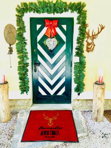 a christmas door with a red bow on it at Mariazeller Alpen Chalet in Mariazell