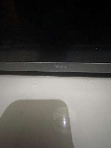 a reflection of a persons shadow on a television screen at Apartamento bulevar jacuzzi centro in Burgos