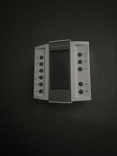 a microwave oven hanging on a wall at Apartamento bulevar jacuzzi centro in Burgos