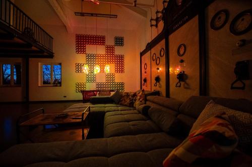 a living room with a couch and a table at Altes Wasserwerk Tecklenburg in Tecklenburg