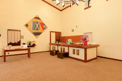 a large room with a counter and a table at Diamond Hakone Society in Hakone